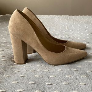 Nude suede pumps.